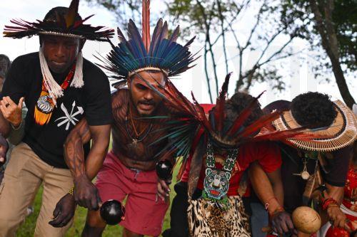 epa12774766 Indigenous people celebrate after the Brazilian government repeals Decree 12600 in front of the Planalto Palace in Brasilia, Brazil, 24 February 2026. The decree had authorized concessions for the construction of three waterways in the Amazon and sparked protests from indigenous groups concerned about the effects of river dredging on their...