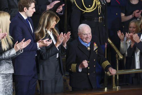 epa12775418 Retired Navy Captain E. Royce Williams (R) receives the Medal of Honor from First Lady Melania Trump (C-L) as he is recognized by US President Donald Trump during his State of the Union address before a joint session of Congress in the House of Representatives chamber of the US Capitol in Washington, DC, USA, 24 February 2026.  EPA/JIM LO SCALZO