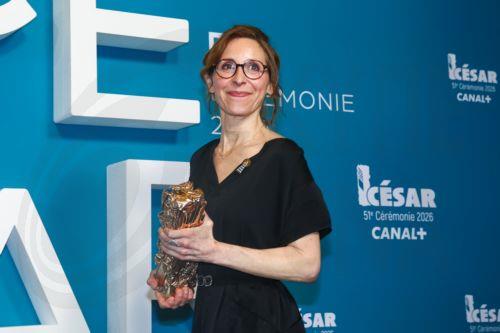 epa12780327 Carine Tardieu winner of the Best Film Award for 'L'attachement' poses in the press room during the 51st annual Cesar awards ceremony held at the Olympia concert hall in Paris, France, 26 February 2026. The awards are presented by the French 'Academie des Arts et Techniques du Cinema' (Academy of Cinema Arts and Techniques).  EPA/CHRISTOPHE...