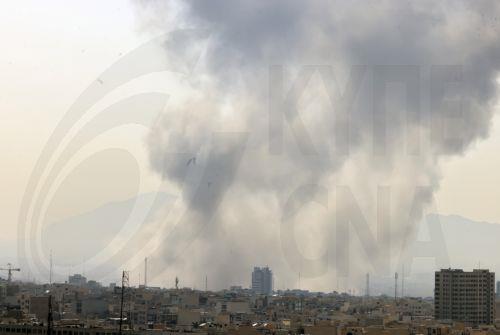 epaselect epa12782928 ​Smoke rises in central Tehran after Israel attack, 28 February 2026. Israel launched an attack on Iran on 28 February 2026, described as a "preemptive strike" by Israeli Defence Minister Israel Katz.  EPA/ABEDIN TAHERKENAREH