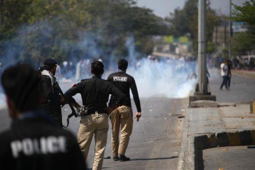 epa12786653 Protestors clash with security forces in Karachi, Pakistan, on 01 March 2026, near the US consulate after Iranian Supreme Leader Ayatollah Ali Khamenei was killed in an Israeli airstrike in Iran. At least 9 protestors were killed in the clashes, according to reports. According to a statement from Iranian state media issued on 01 March 2026,...