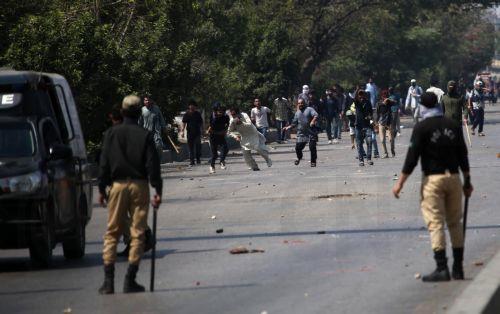 epa12786659 Protestors clash with security forces in Karachi, Pakistan, on 01 March 2026, near the US consulate after Iranian Supreme Leader Ayatollah Ali Khamenei was killed in an Israeli airstrike in Iran. At least 9 protestors were killed in the clashes, according to reports. According to a statement from Iranian state media issued on 01 March 2026,...