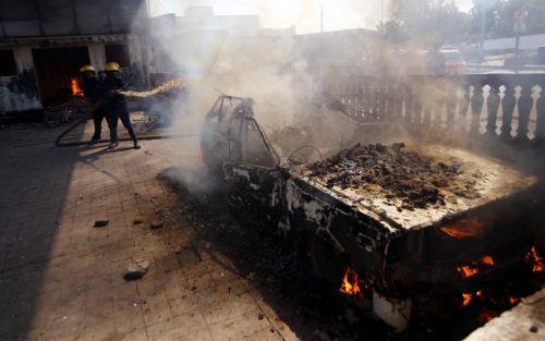 epaselect epa12786598 Firefighters at the scene of clashes between protestors and security forces in Karachi, Pakistan, on 01 March 2026, near the US consulate after Iranian Supreme Leader Ayatollah Ali Khamenei was killed in an Israeli airstrike in Iran. At least 9 protestors were killed in the clashes, according to reports. According to a statement from...