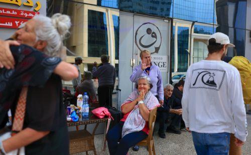 epa12789639 Passengers stranded by suspended air traffic from Austria, Swiss and Serbia wait in front of a hotel in Doha, Qatar, 02 March 2026. Following a joint Israel-US military operation targeting multiple locations across Iran in the early hours of 28 February 2026 and Iran's retaliatory attacks across the region, several countries closed their...