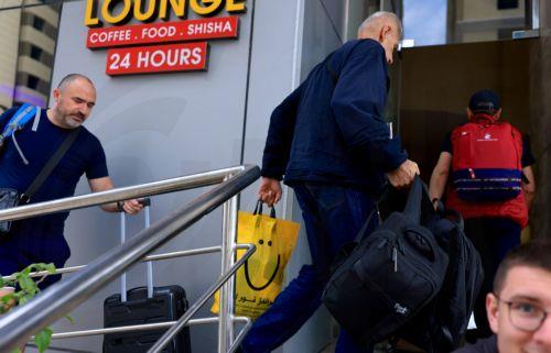 epa12789643 Passengers stranded by suspended air traffic from Serbia enter a hotel in Doha, Qatar, 02 March 2026. Following a joint Israel-US military operation targeting multiple locations across Iran in the early hours of 28 February 2026 and Iran's retaliatory attacks across the region, several countries closed their airspace and airlines cancelled...