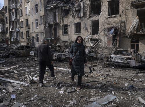 epa12790484 A handout photo made available by the press service of the 93rd 'Kholodnyi Yar' Separate Mechanized Brigade of the Ukrainian Armed Forces shows residents walking past a destroyed residential building following a Russian strike in the frontline city of Druzhkivka, Donetsk region, eastern Ukraine, 02 March 2026. At least five people were killed -...
