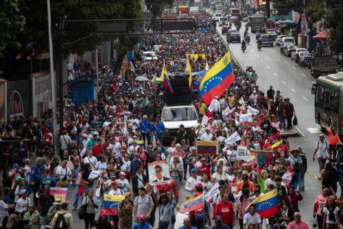 epa12793162 People participate in a march in Caracas, Venezuela, 03 March 2026. Hundreds of Chavistas march to demand the release of Nicolas Maduro and his wife Cilia Flores two months after their capture by US military forces following an attack on Caracas and three nearby regions.  EPA/Ronald Peña R