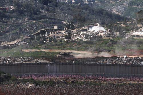 epaselect epa12797117 An Israeli tank maneuvers in the southern Lebanese village of Kfar Kila, as seen from the border in Upper Galilee, northern Israel, 05 March 2026. The Israeli military stated it is conducting strikes across Lebanon targeting Hezbollah infrastructure and personnel.  EPA/ATEF SAFADI