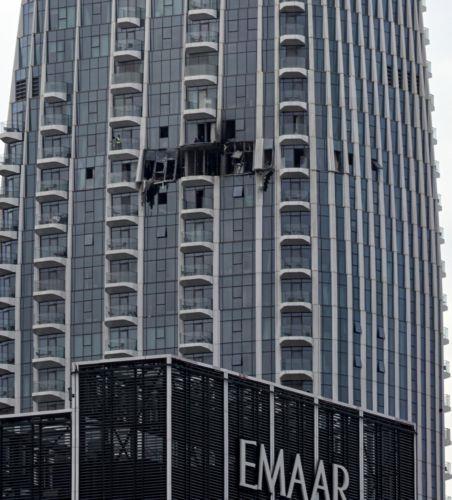 epa12814070 A view of the damaged part of the Dubai Creek Harbour Tower after it was hit by an Iranian drone attack in Dubai, United Arab Emirates, 12 March 2026.  EPA/STRINGER