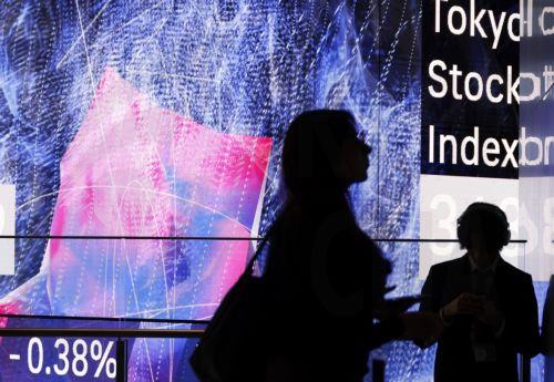 epa12816144 Employees are silhouetted before a large stock market indicator board in Tokyo, Japan, 13 March 2026. The Nikkei Stock Average continued to fall, at one point dropping more than 1,100 points from the previous day. Investors sentiment worsened following the surge of crude oil prices amid the Middle East conflict.  EPA/FRANCK ROBICHON