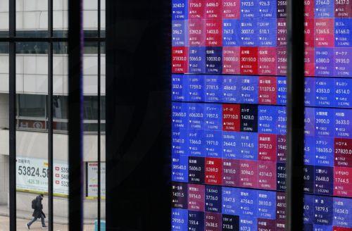 epa12816147 A passerby walks before a stock market indicator board in Tokyo, Japan, 13 March 2026. The Nikkei Stock Average continued to fall, at one point dropping more than 1,100 points from the previous day. Investors sentiment worsened following the surge of crude oil prices amid the Middle East conflict.  EPA/FRANCK ROBICHON