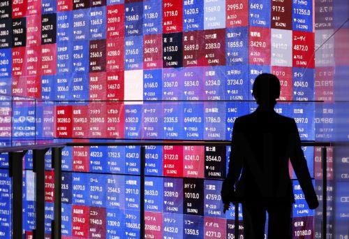 epa12816148 A young woman is silhouetted before a large stock market indicator board in Tokyo, Japan, 13 March 2026. The Nikkei Stock Average continued to fall, at one point dropping more than 1,100 points from the previous day. Investors sentiment worsened following the surge of crude oil prices amid the Middle East conflict.  EPA/FRANCK ROBICHON