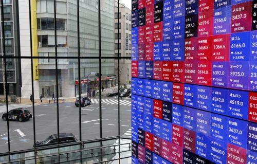 epa12816151 Vehicles run through a crossing in the background of a large stock market indicator board in Tokyo, Japan, 13 March 2026. The Nikkei Stock Average continued to fall, at one point dropping more than 1,100 points from the previous day. Investors sentiment worsened following the surge of crude oil prices amid the Middle East conflict.  EPA/FRANCK...