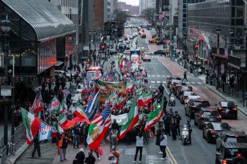 epa12823487 People carry the monarchist flag of Iran during a ‘Freedom for Iran’ protest in New York, New York, USA, 15 March 2026. The rally comes amid ongoing hostilities involving the United States, Israel and Iran.  EPA/OLGA FEDOROVA
