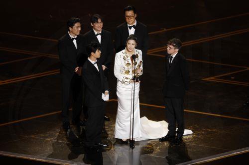 epa12824243 (Front L-R) Yu Han Lee, EJAE, Mark Sonnenblick and (back L-R) Jeong Hoon Seo, Hee Dong Nam, Joong Gyu Kwak on stage after winning the Oscar for Best Music (Original Song) for "Golden" from "KPop Demon Hunters"  during the 98th annual Academy Awards ceremony at the Dolby Theatre in Los Angeles, California, USA, 15 March 2026.  EPA/CHRIS TORRES