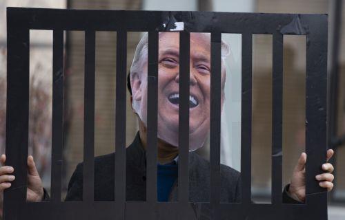 epa12826565 A South Korean protester wearing a mask of US President Donald Trump performs as others shout slogans during a demonstration outside the US Embassy in Seoul, South Korea, 17 March 2026. Protesters gathered to oppose Trump’s request for South Korea to send ships to the Strait of Hormuz.  EPA/JEON HEON-KYUN