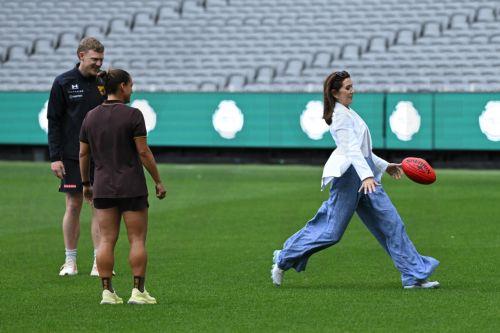 epa12826580 Denmark's Queen Mary (R) kicks a rugby football at the MCG in Melbourne, Australia, 17 March 2026. The royal couple is visiting Australia from 14 March until 19 March 2026.  EPA/JAMES ROSS AUSTRALIA AND NEW ZEALAND OUT