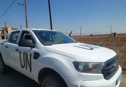 UN vehicles remain in the buffer zone wh